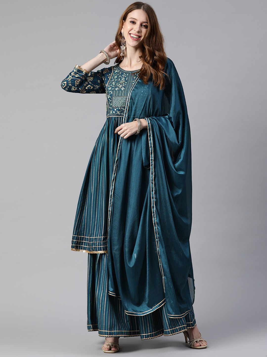 SheWill Women Teal Ethnic Motifs Yoke Design Gotta Patti Kurta with Sharara & With Dupatta
SheWill Women Teal Ethnic Motifs Yoke Design Gotta Patti Kurta with Sharara & With Dupatta