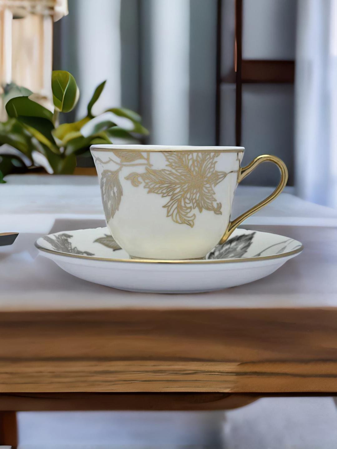 Athome by Nilkamal White & Gold-Toned Geometric Printed Ceramic Matte Cups Set of Cups and Mugs
Athome by Nilkamal White & Gold-Toned Geometric Printed Ceramic Matte Cups Set of Cups and Mugs