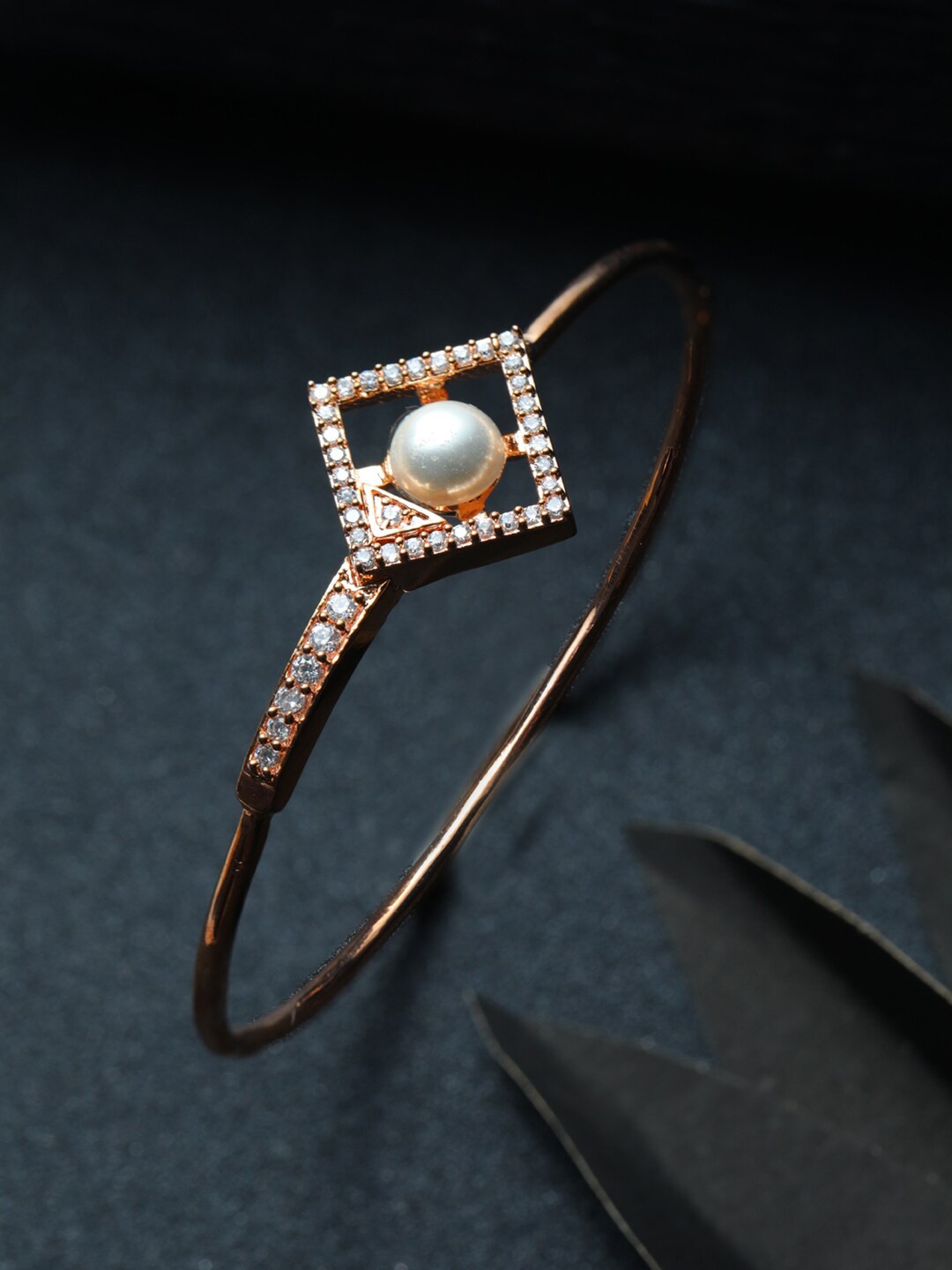 Priyaasi Women Rose Gold & Off White Brass American Diamond Rose Gold-Plated Bangle-Style Bracelet
Priyaasi Women Rose Gold & Off White Brass American Diamond Rose Gold-Plated Bangle-Style Bracelet