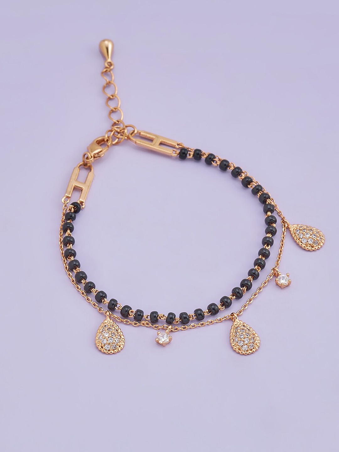 Kushal's Fashion Jewellery Women Black & Rose Gold Toned & Plated Mangalsutra Bracelet
Kushal's Fashion Jewellery Women Black & Rose Gold Toned & Plated Mangalsutra Bracelet