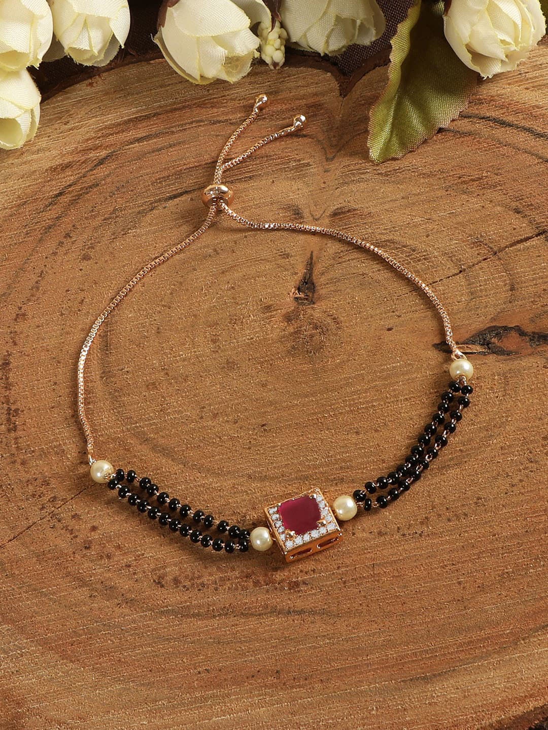 ZINU Women Rose gold plated & Black Brass cubic zirconia studded Hand Mangalsutra Bracelet
ZINU Women Rose gold plated & Black Brass cubic zirconia studded Hand Mangalsutra Bracelet