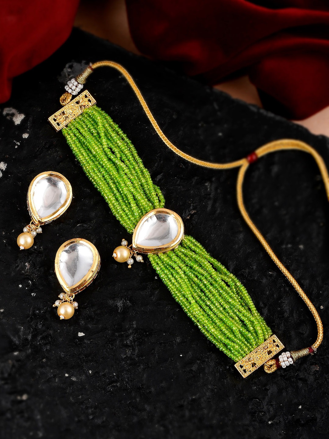 Shoshaa Gold-Plated Green & White Stone Studded & Beaded Handcrafted Jewellery Set
Shoshaa Gold-Plated Green & White Stone Studded & Beaded Handcrafted Jewellery Set