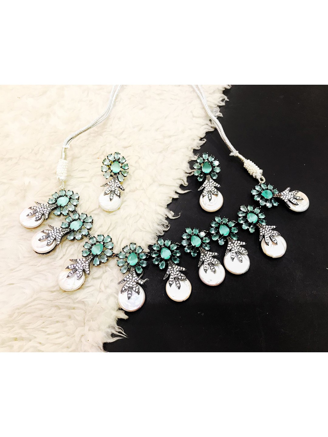 SURYAM DESIGNER JEWELLERY Silver-Plated Turquoise Blue American Diamond Studded Jewellery Set
SURYAM DESIGNER JEWELLERY Silver-Plated Turquoise Blue American Diamond Studded Jewellery Set