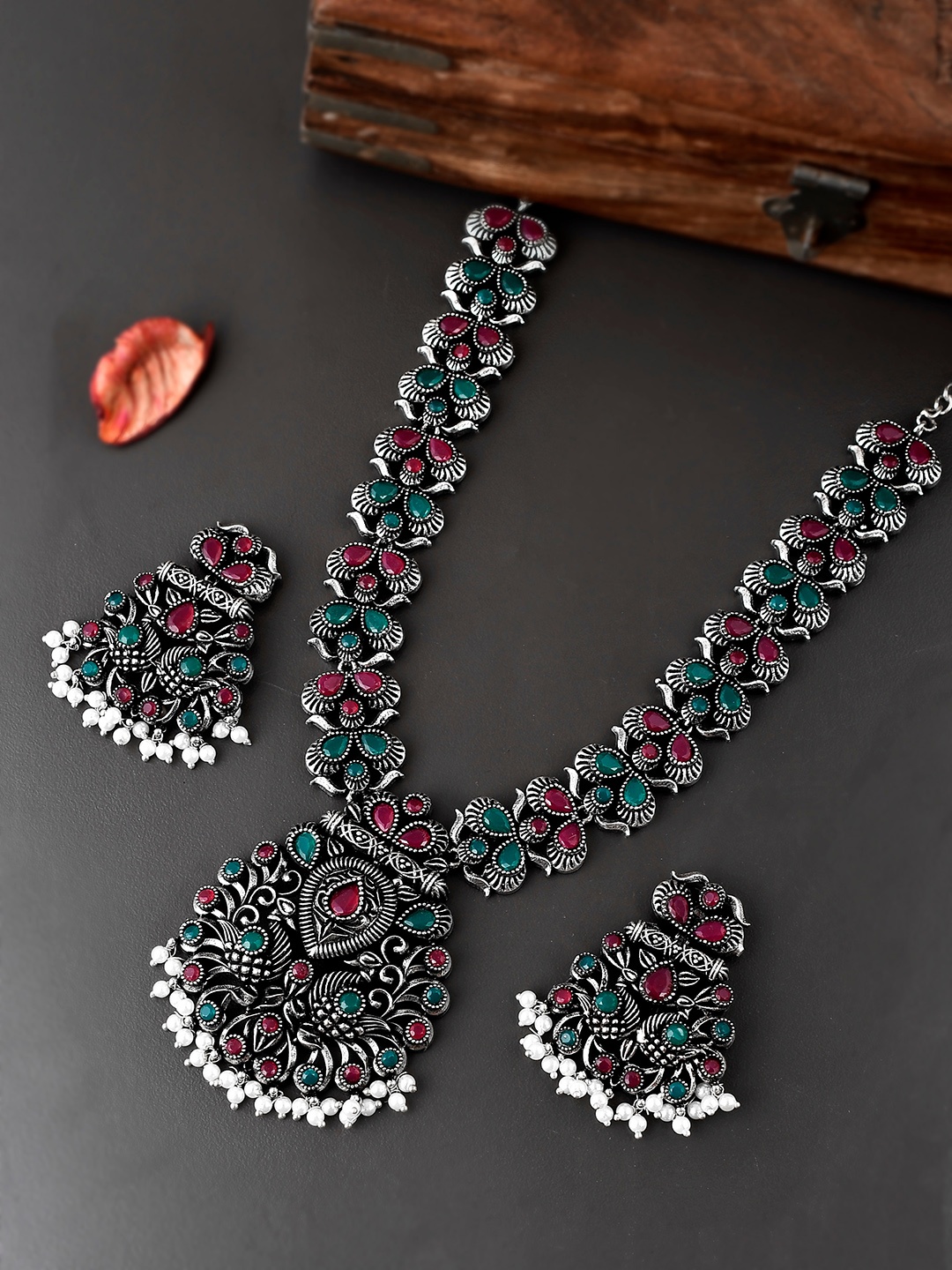 AQUASTREET JEWELS Oxidised Silver-Plated Red & Green Stone Studded Peacock Motif Necklace Set
AQUASTREET JEWELS Oxidised Silver-Plated Red & Green Stone Studded Peacock Motif Necklace Set