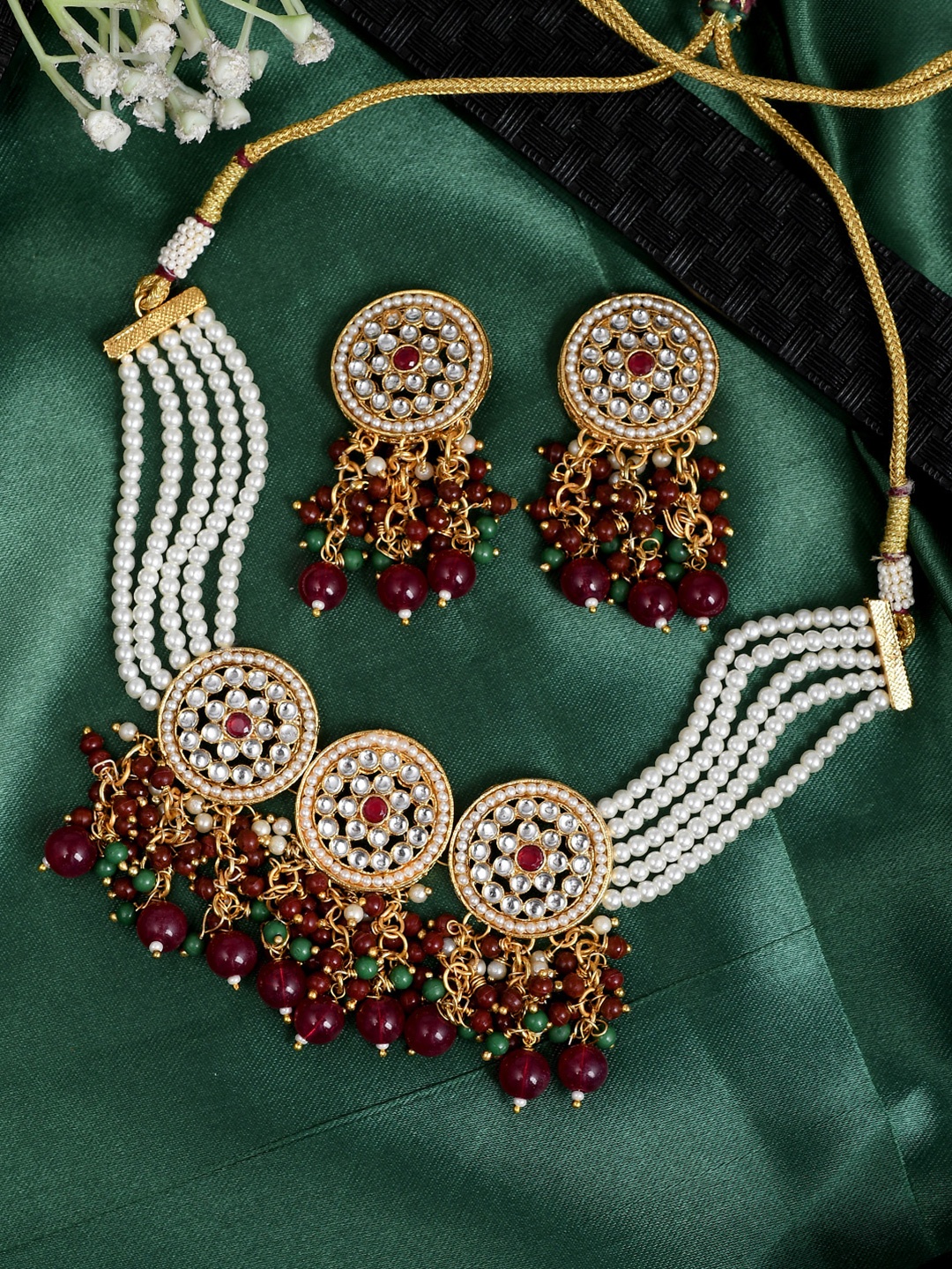 AQUASTREET JEWELS Gold-Plated Red Kundan Studded Pearl Jewellery Set With Tassel drops
AQUASTREET JEWELS Gold-Plated Red Kundan Studded Pearl Jewellery Set With Tassel drops