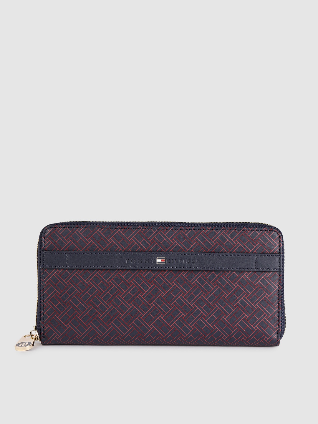 Tommy Hilfiger Women Navy Blue & Red Brand Logo Print Applique Leather Zip Around Wallet
Tommy Hilfiger Women Navy Blue & Red Brand Logo Print Applique Leather Zip Around Wallet