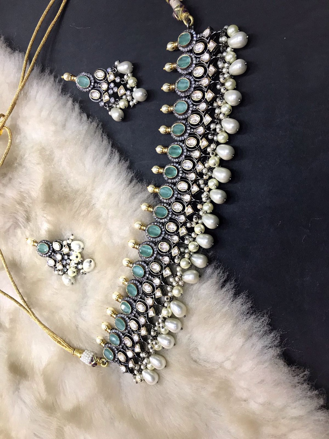 SURYAM DESIGNER JEWELLERY Gold-Plated Sea Green Coloured White Kundan Studded Necklace Set
SURYAM DESIGNER JEWELLERY Gold-Plated Sea Green Coloured White Kundan Studded Necklace Set