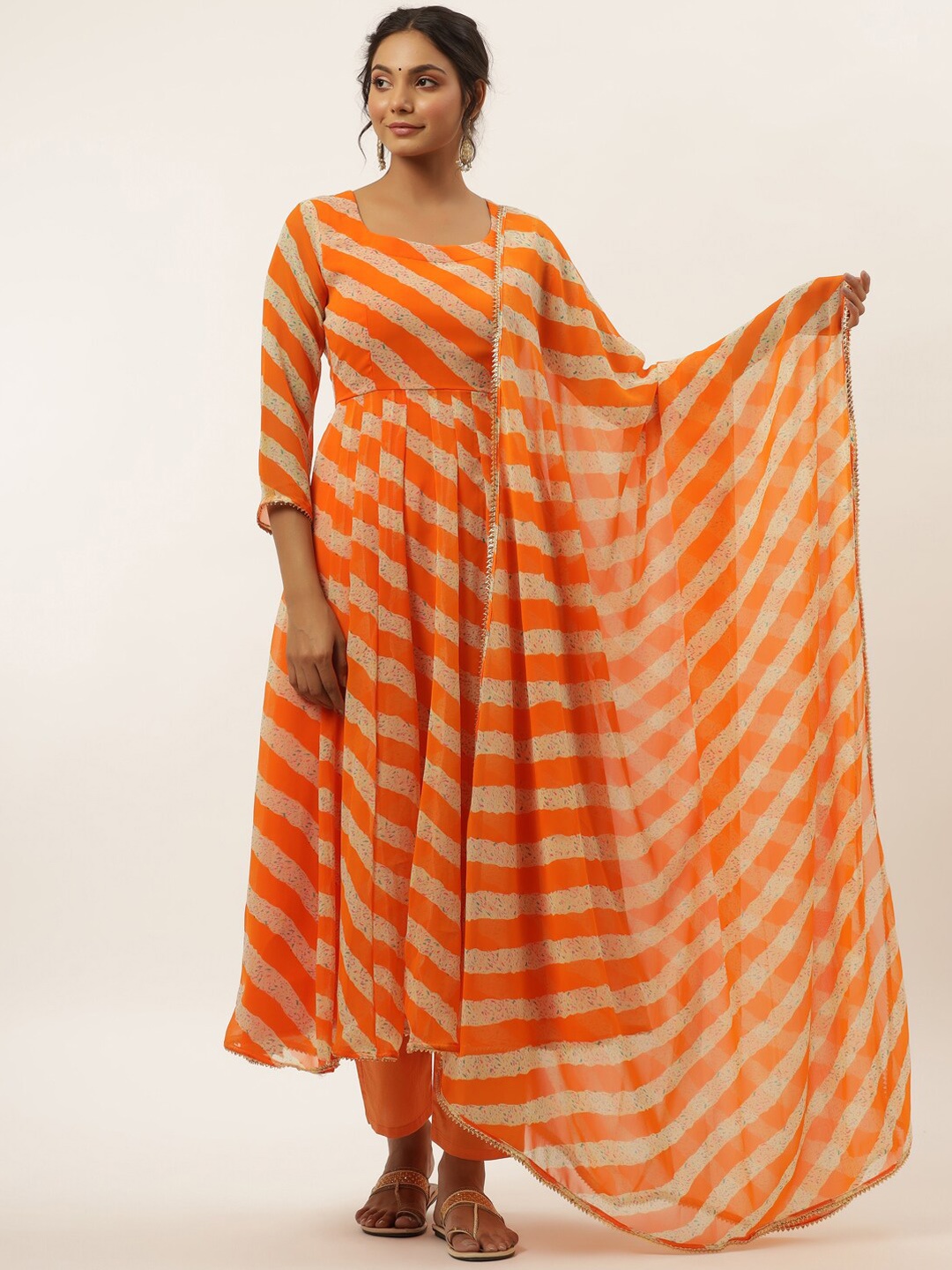 HOUSE OF JAMOTI Women Orange Striped Panelled Silk Georgette Kurta with Trousers & With Dupatta
HOUSE OF JAMOTI Women Orange Striped Panelled Silk Georgette Kurta with Trousers & With Dupatta