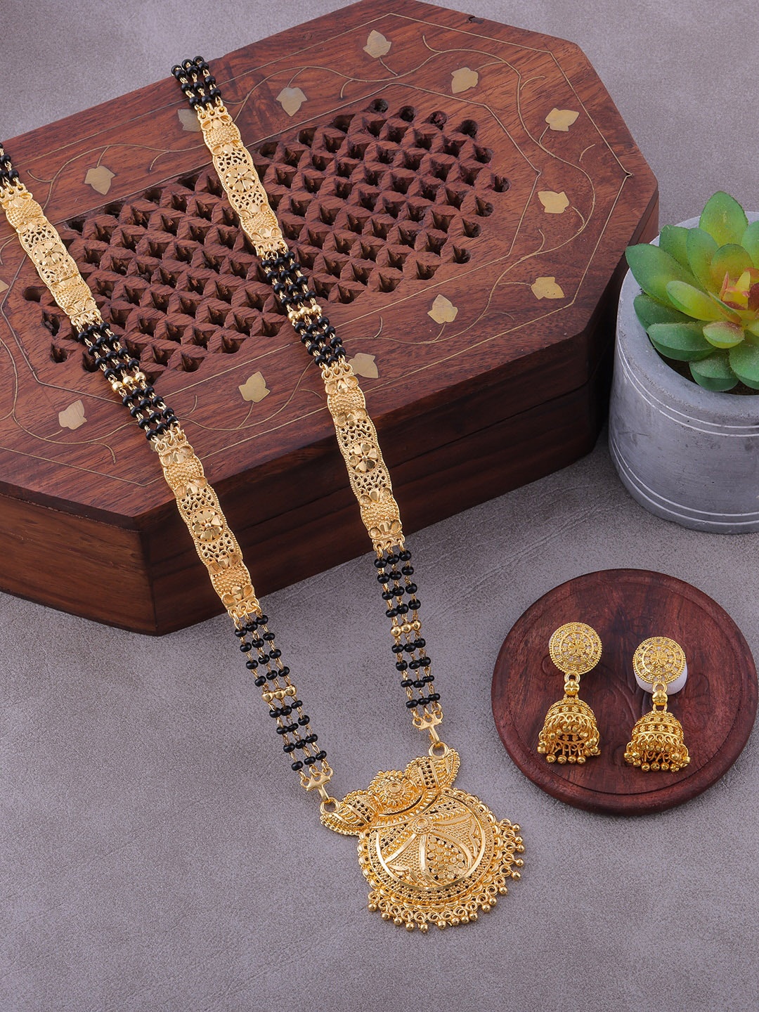 Brandsoon Gold-Plated Black Stone-Studded & Beaded Mangalsutra With Earrring Set
Brandsoon Gold-Plated Black Stone-Studded & Beaded Mangalsutra With Earrring Set