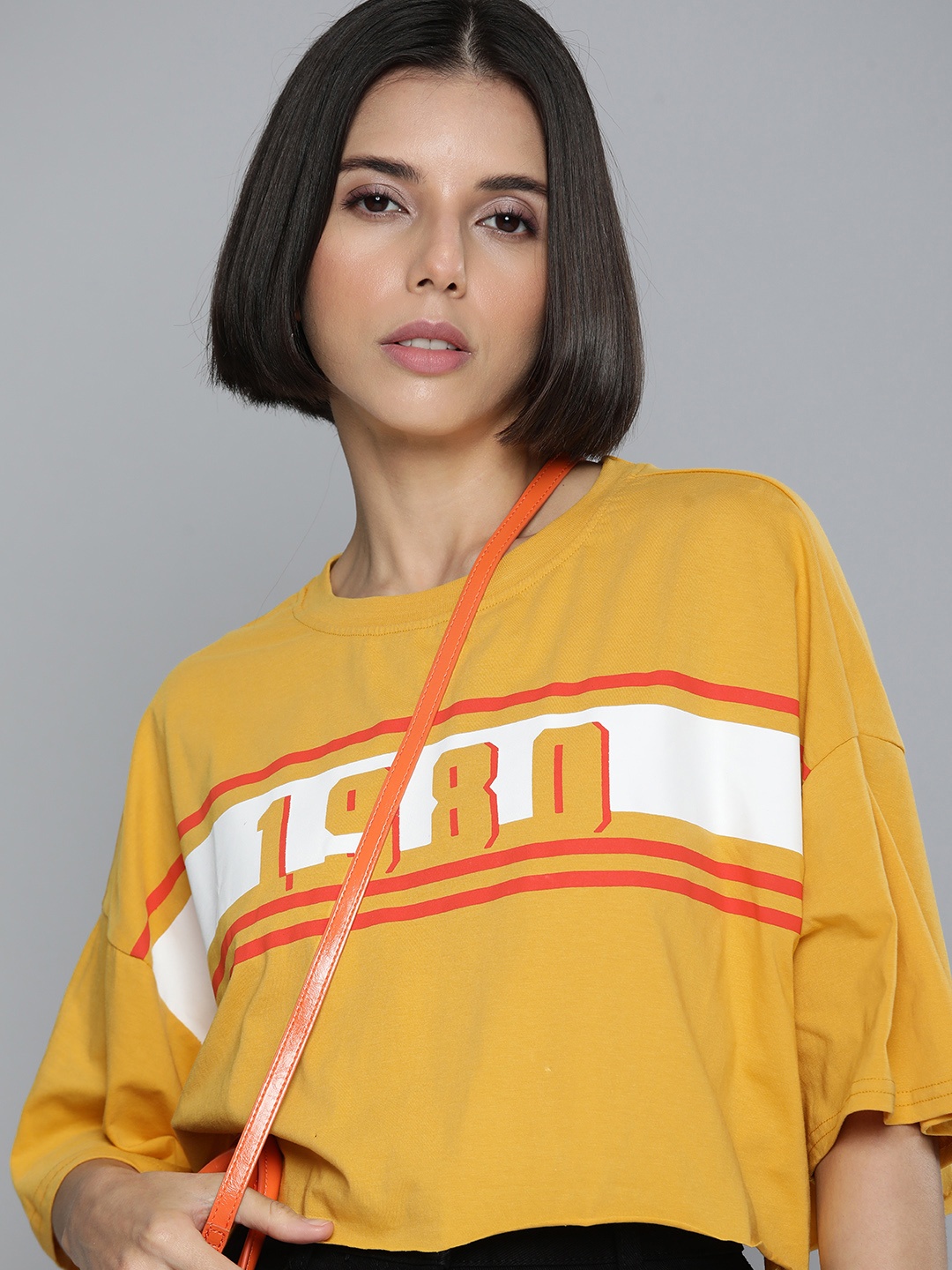 Flying Machine Women Mustard Yellow & White Printed Drop-Shoulder Crop Boxy T-shirt
Flying Machine Women Mustard Yellow & White Printed Drop-Shoulder Crop Boxy T-shirt