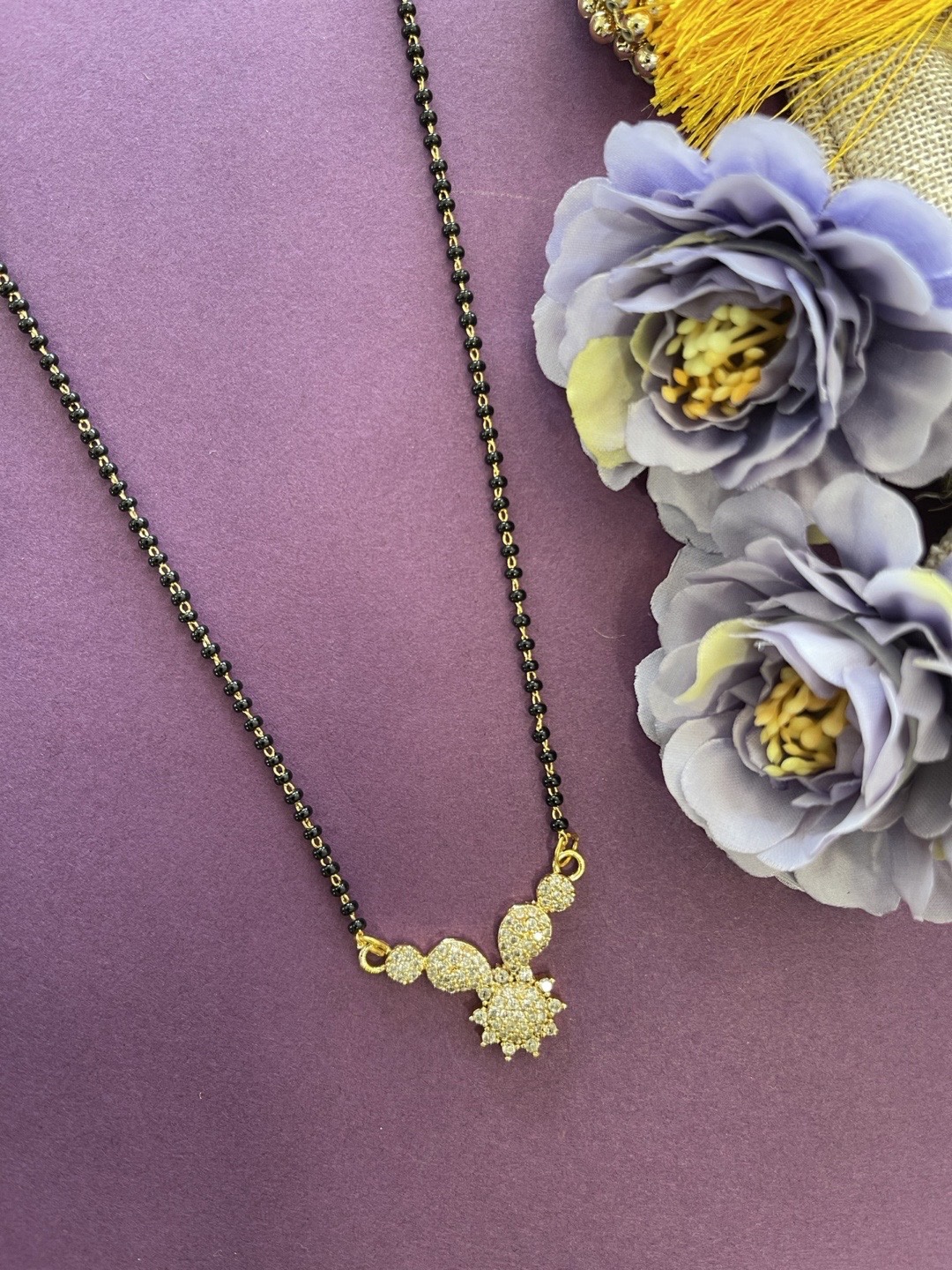 Digital Dress Room Gold-Plated White & Black AD-Studded Beaded Mangalsutra
Digital Dress Room Gold-Plated White & Black AD-Studded Beaded Mangalsutra