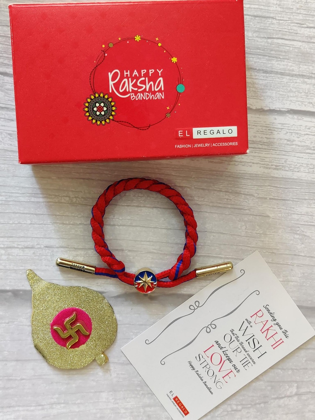 EL REGALO Bracelet Rakhi Combo for Bhaiya With Roli Chawal Shagun and Greeting Card, Blue
EL REGALO Bracelet Rakhi Combo for Bhaiya With Roli Chawal Shagun and Greeting Card, Blue
