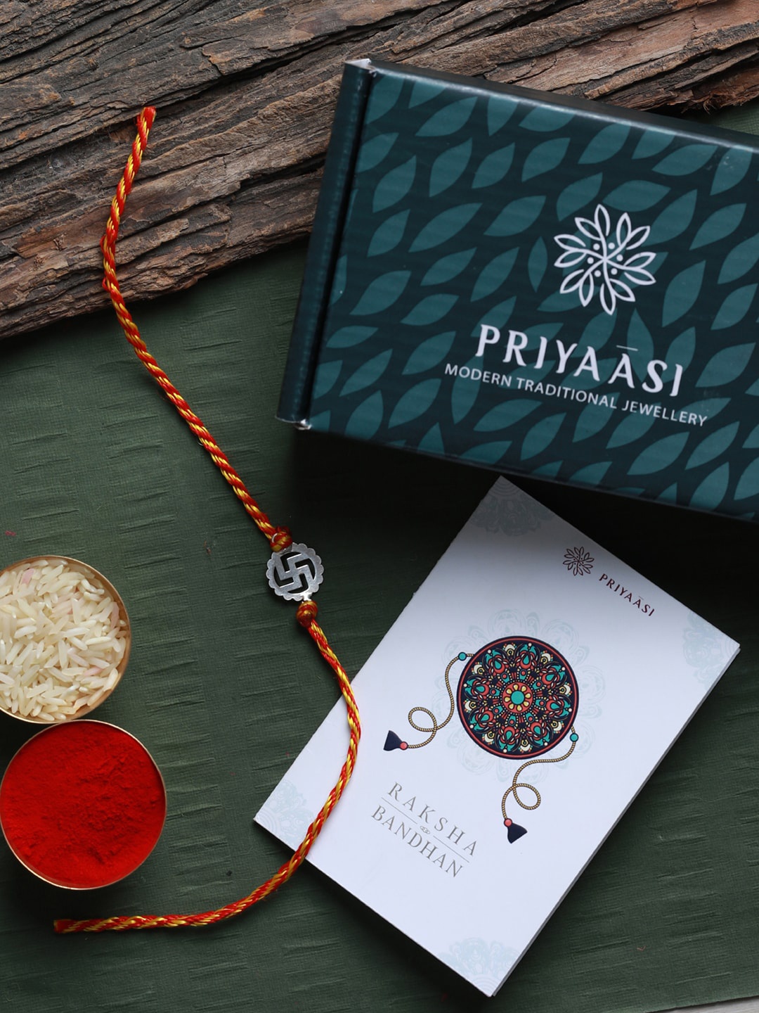 SHEER by Priyaasi Silver & Red Swastik 92.5 Sterling Silver Rakhi with Roli Chawal & Card
SHEER by Priyaasi Silver & Red Swastik 92.5 Sterling Silver Rakhi with Roli Chawal & Card