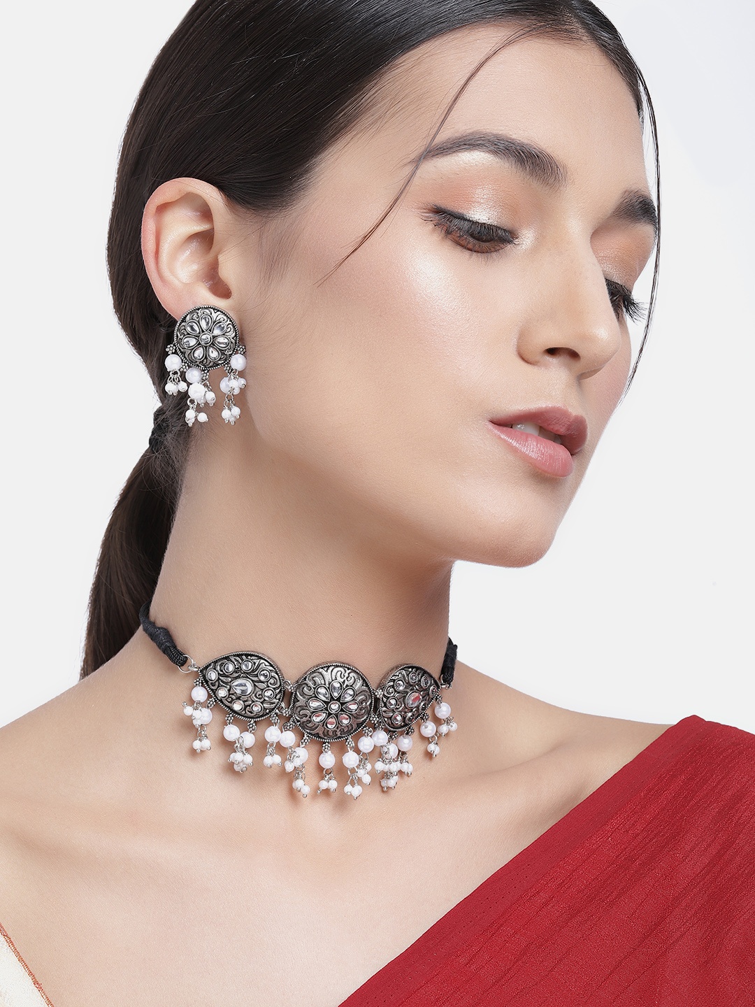 Kord Store White Silver-Plated Oxidized Beaded Peacock Shaped Choker Jewellery Set
Kord Store White Silver-Plated Oxidized Beaded Peacock Shaped Choker Jewellery Set