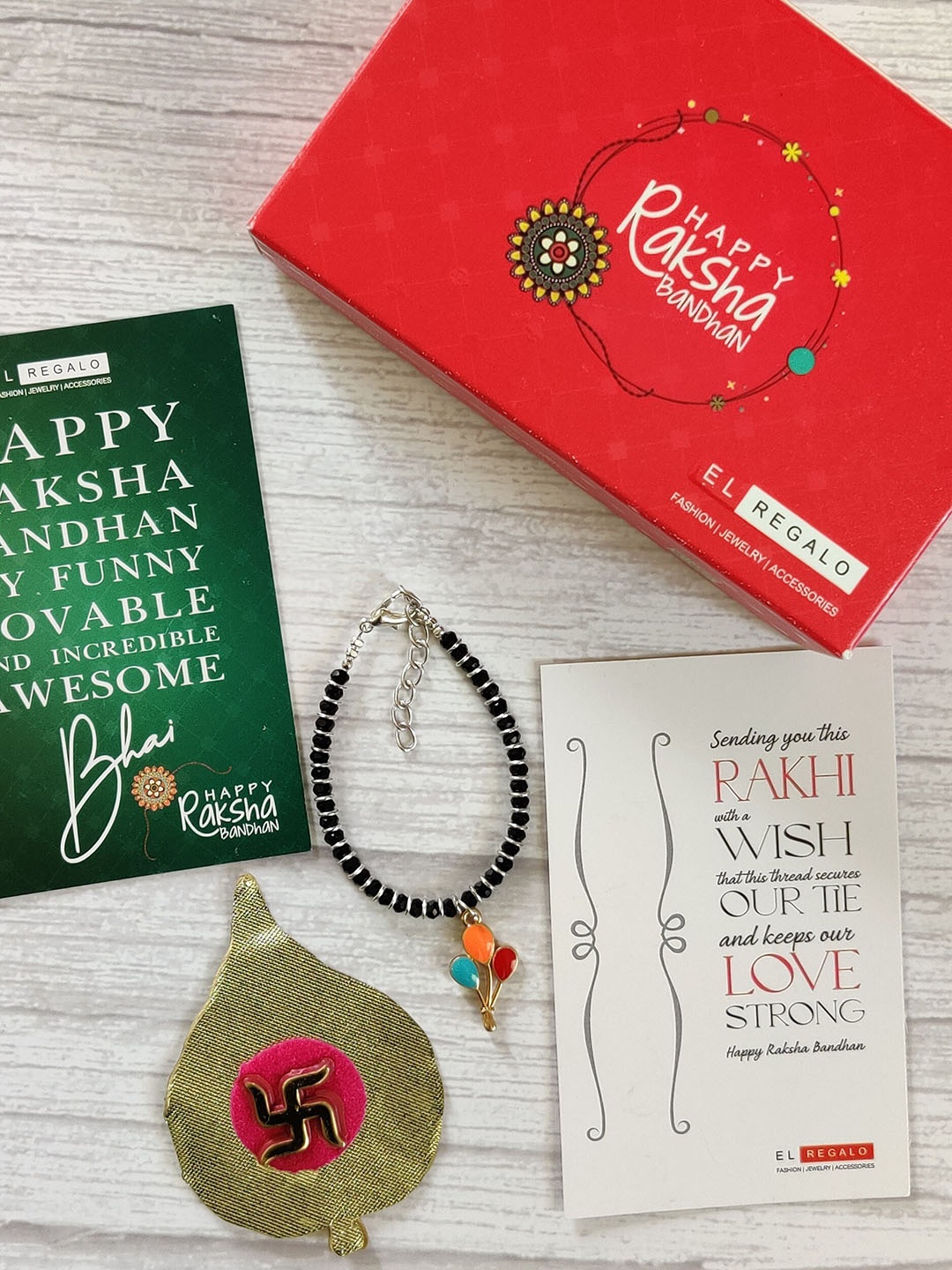 EL REGALO Kids Red Nazaria Rakhi Combo with Greeting Card & Roli Chawal Shagun
EL REGALO Kids Red Nazaria Rakhi Combo with Greeting Card & Roli Chawal Shagun