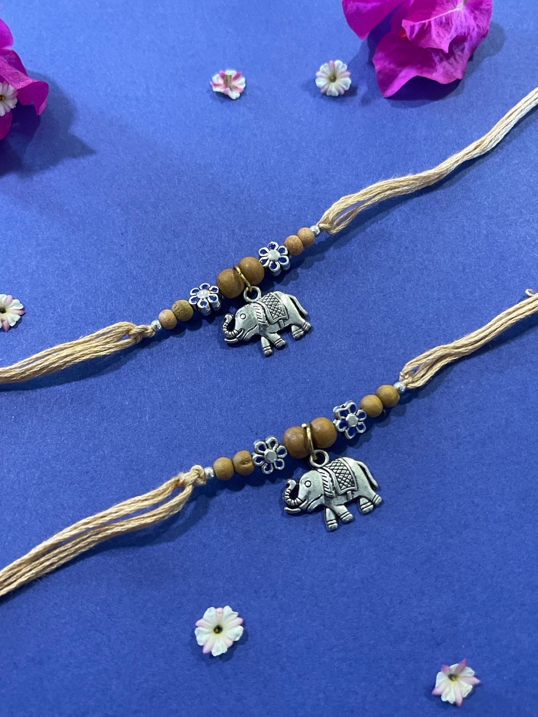 Digital Dress Room Men Set of 2 Cream & Silver Flower & Elephant Shaped Pendant Rakhi
Digital Dress Room Men Set of 2 Cream & Silver Flower & Elephant Shaped Pendant Rakhi