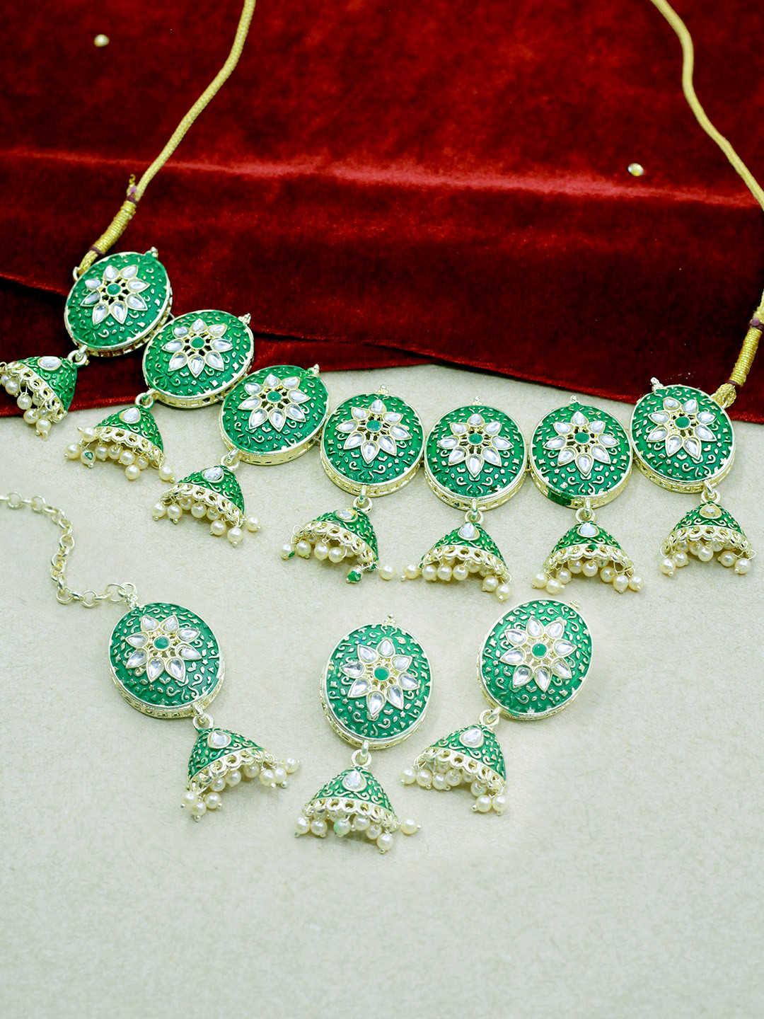 SAIYONI Gold-Plated & Green Kundan-Studded & Pearl Beaded Meenakari Jewellery Set With Maangtikka
SAIYONI Gold-Plated & Green Kundan-Studded & Pearl Beaded Meenakari Jewellery Set With Maangtikka