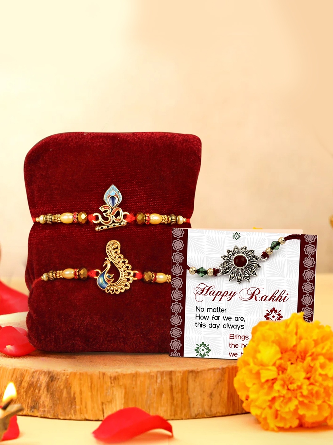 TIED RIBBONS Set of 2 Stoned-Studded Om & Peacock Rakhi with Card & Roli Chawal, Gold
TIED RIBBONS Set of 2 Stoned-Studded Om & Peacock Rakhi with Card & Roli Chawal, Gold