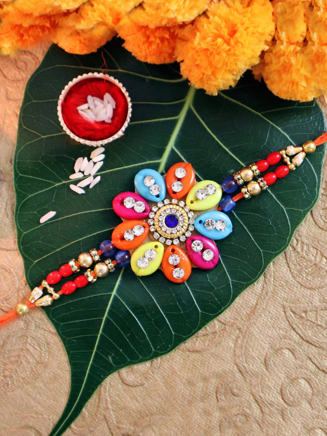 TIED RIBBONS Red Designer Stoned-Studded Floral Rakhi with Card & Roli Chawal Gift Set
TIED RIBBONS Red Designer Stoned-Studded Floral Rakhi with Card & Roli Chawal Gift Set
