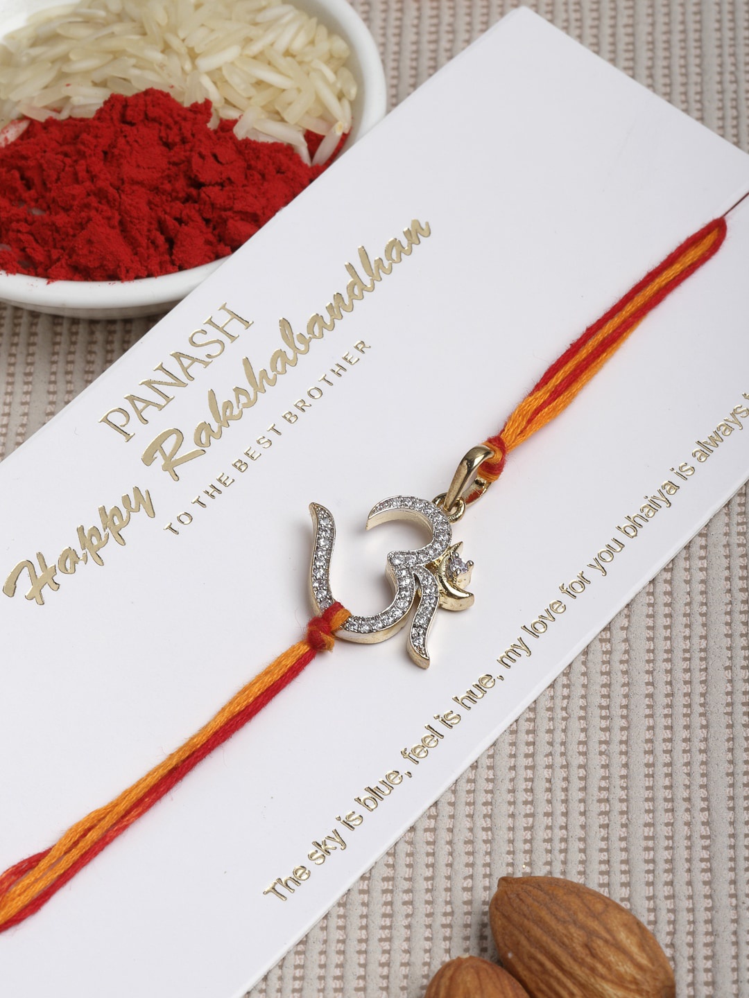 PANASH Men Red & Gold-Toned AD-Studded Om Convertible Pendant Rakhi With Rolichawal
PANASH Men Red & Gold-Toned AD-Studded Om Convertible Pendant Rakhi With Rolichawal