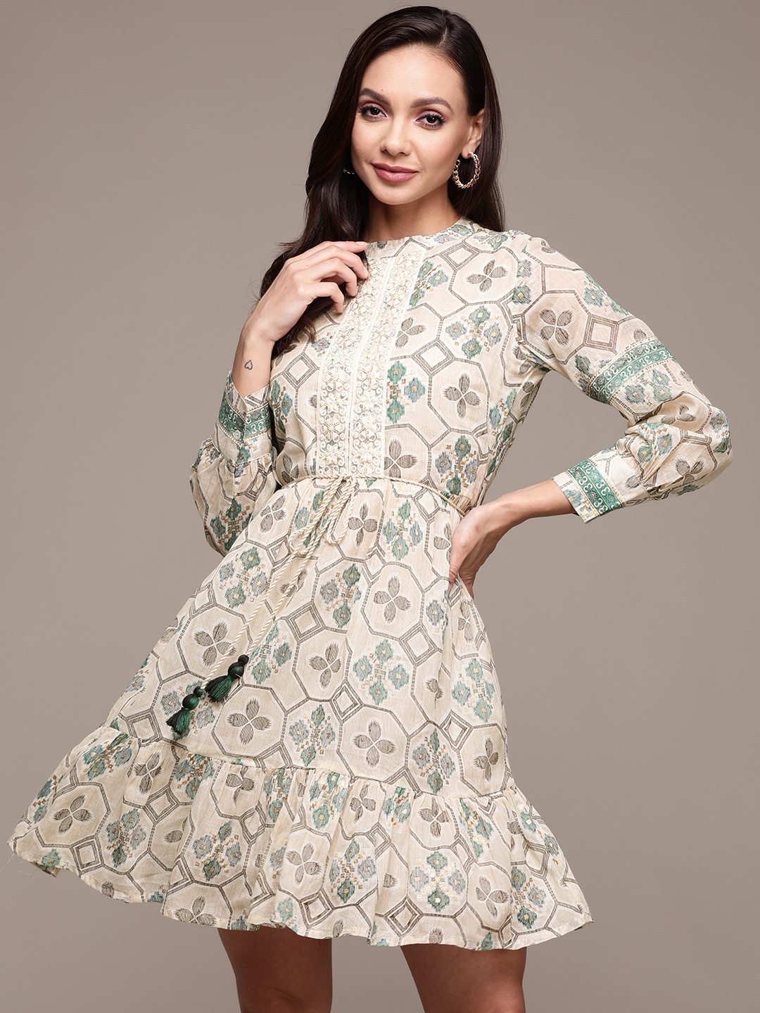 Ishin Beige & Green Ethnic Motifs Embroidered Embellished Lace Inserts Cotton A-Line Dress
Ishin Beige & Green Ethnic Motifs Embroidered Embellished Lace Inserts Cotton A-Line Dress