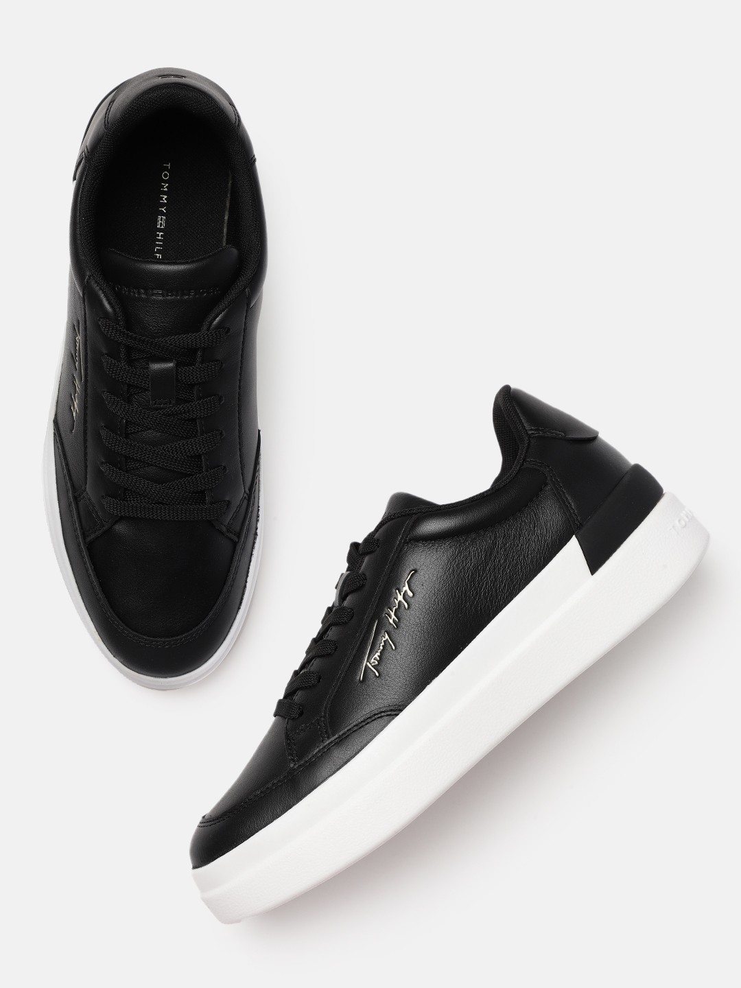 Tommy Hilfiger Women Black Solid Leather Regular Sneakers with Brand Logo Embossed Detail
Tommy Hilfiger Women Black Solid Leather Regular Sneakers with Brand Logo Embossed Detail
