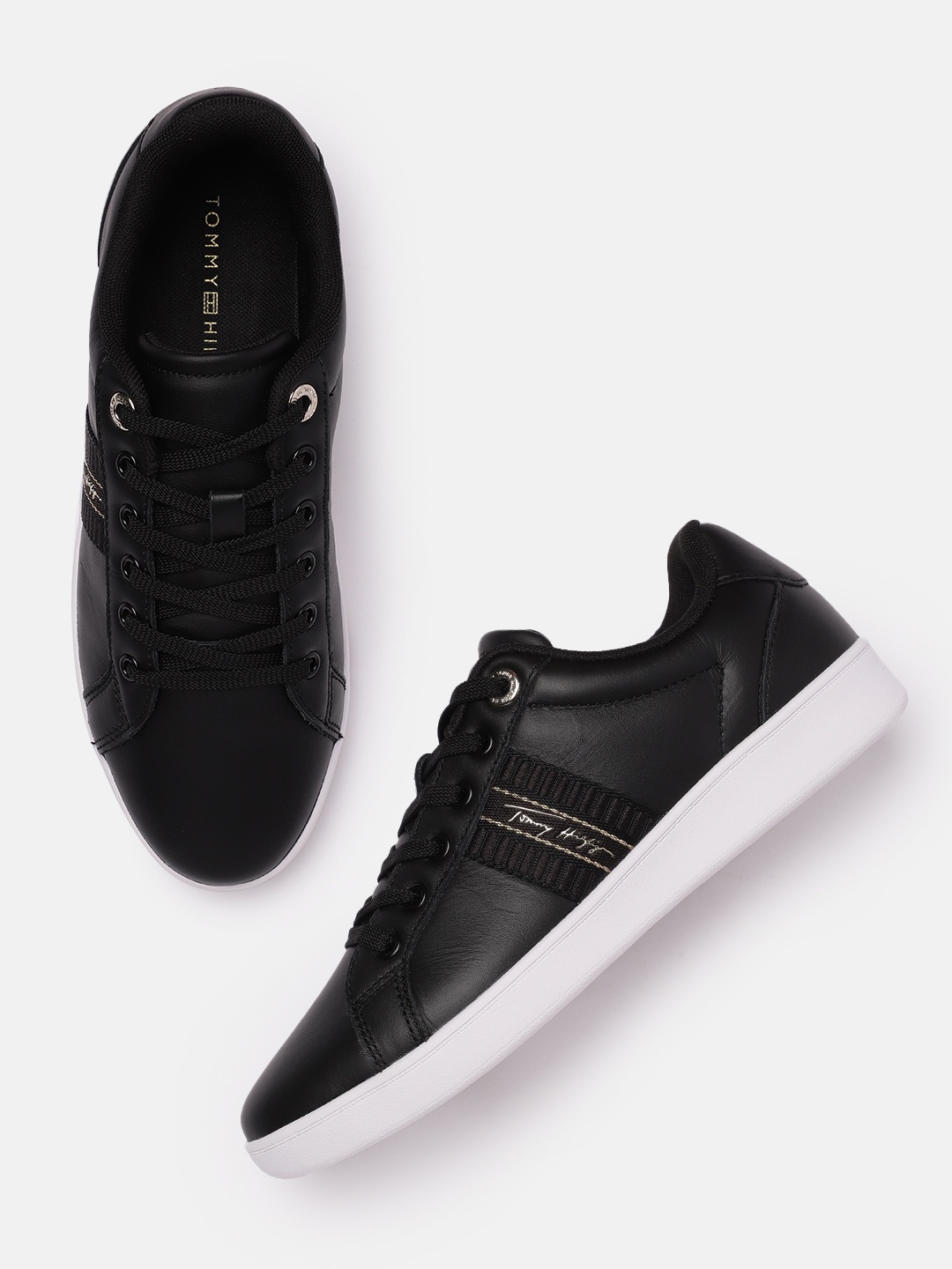 Tommy Hilfiger Women Black Solid Leather Regular Court Sneakers with Woven Design Detail
Tommy Hilfiger Women Black Solid Leather Regular Court Sneakers with Woven Design Detail