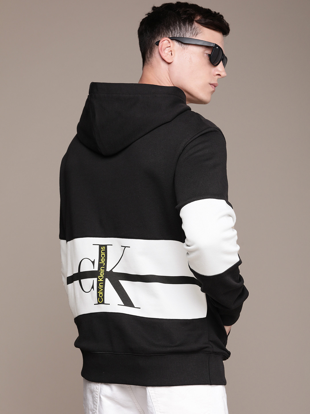 Calvin Klein Jeans Men Black & White Colourblocked Hooded Sweatshirt with Logo Print
Calvin Klein Jeans Men Black & White Colourblocked Hooded Sweatshirt with Logo Print