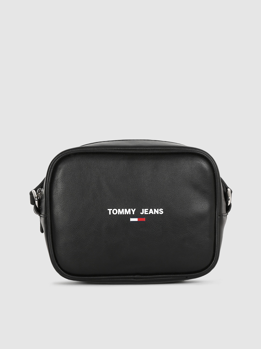 Tommy Hilfiger Black Solid PU Regular Structured Sling Bag with Brand Logo Print Detail
Tommy Hilfiger Black Solid PU Regular Structured Sling Bag with Brand Logo Print Detail