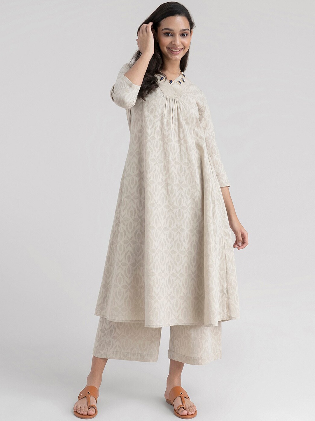 Pink Fort Women Beige Printed Pleated Pure Cotton Kurti with Palazzos & With Dupatta
Pink Fort Women Beige Printed Pleated Pure Cotton Kurti with Palazzos & With Dupatta