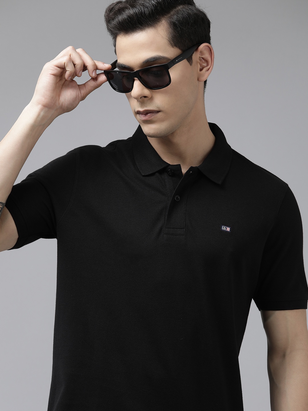 Arrow Men Black Solid Polo Collar Brand Logo Applique T-shirt