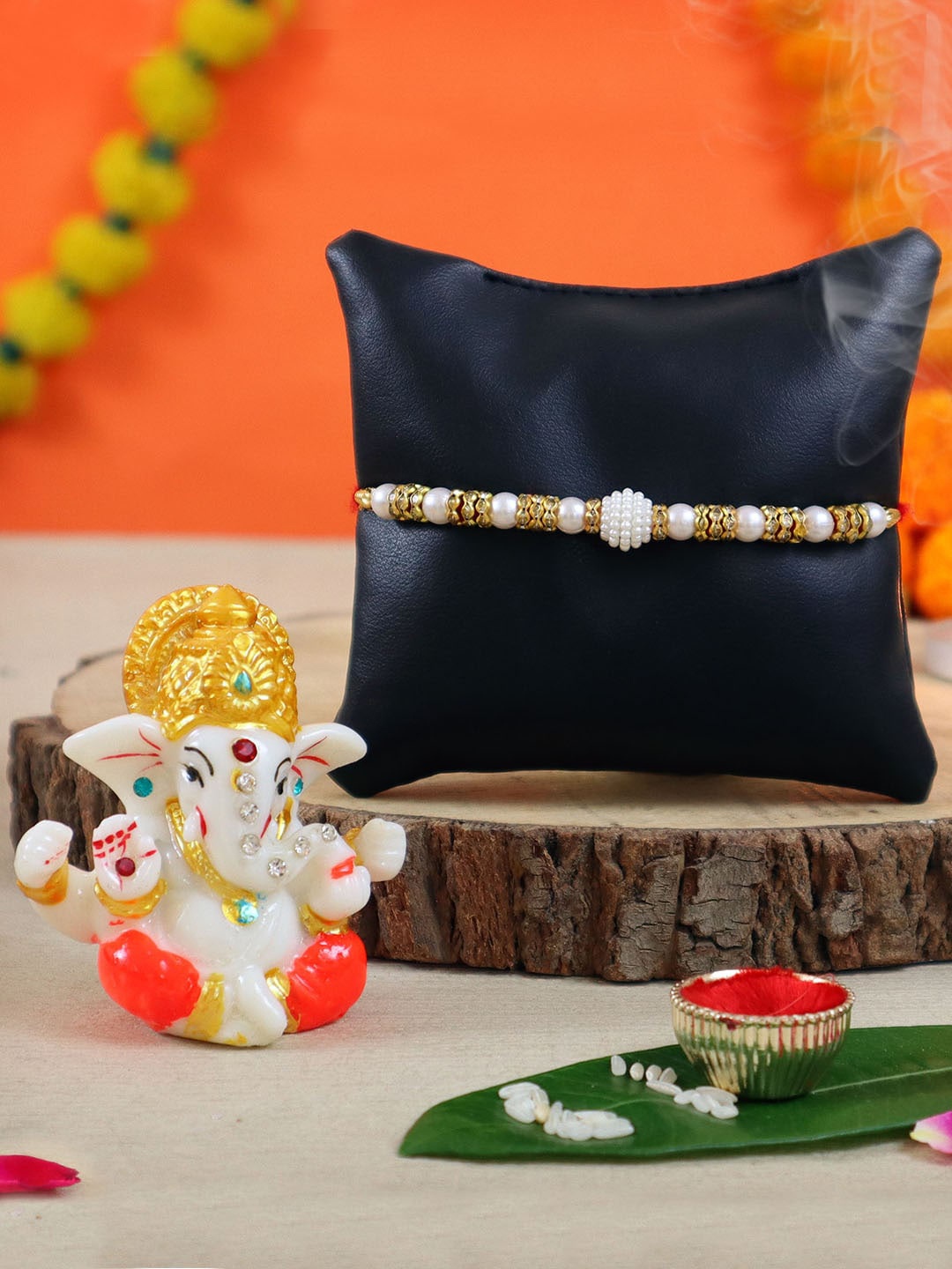 TIED RIBBONS Men Multicoloured Pearl Rakhi with Mini Ganesha Idol Statue Gift Set, Multi
TIED RIBBONS Men Multicoloured Pearl Rakhi with Mini Ganesha Idol Statue Gift Set, Multi