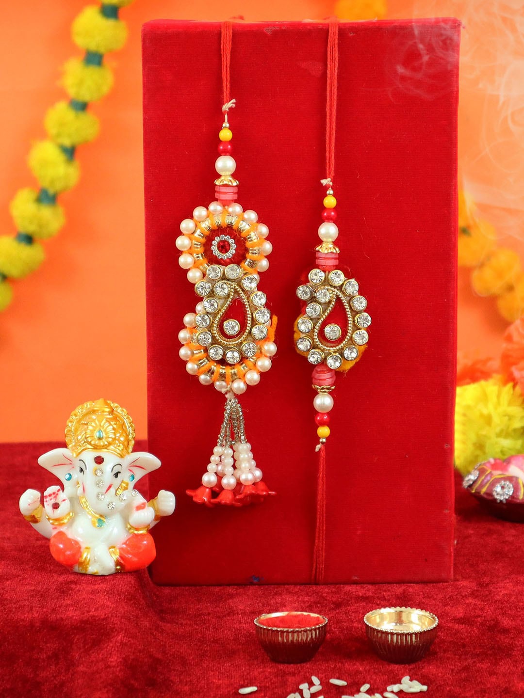 TIED RIBBONS Adults Multi-Colour Bhaiya Bhabhi Rakhi Combo with Mini Ganesha Idol Gift
TIED RIBBONS Adults Multi-Colour Bhaiya Bhabhi Rakhi Combo with Mini Ganesha Idol Gift