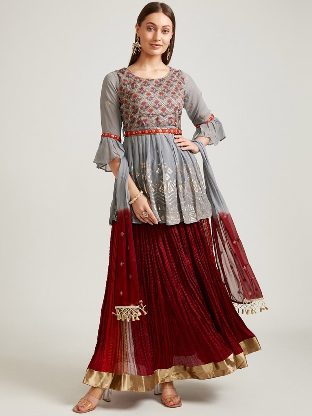 Neerus Women Grey Ethnic Motifs Yoke Design Pleated Sequinned Kurti with Skirt & With Dupatta
Neerus Women Grey Ethnic Motifs Yoke Design Pleated Sequinned Kurti with Skirt & With Dupatta