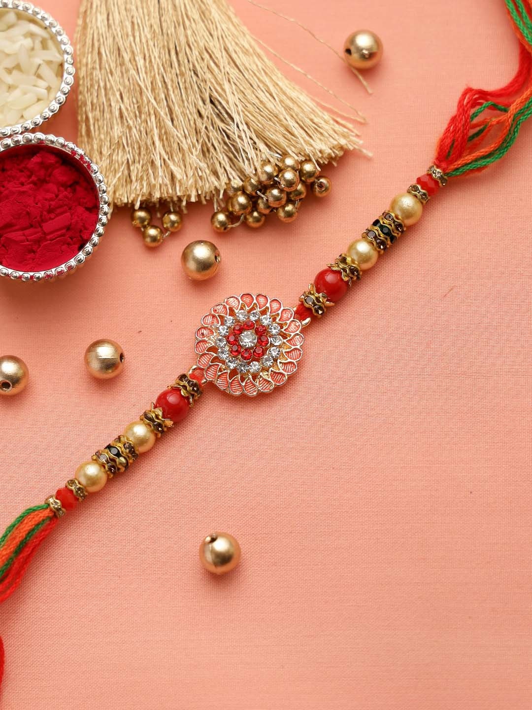 Aapno Rajasthan Red & Gold-Toned CZ Studded Embellished Rakhi with Roli Chawal & Card
Aapno Rajasthan Red & Gold-Toned CZ Studded Embellished Rakhi with Roli Chawal & Card