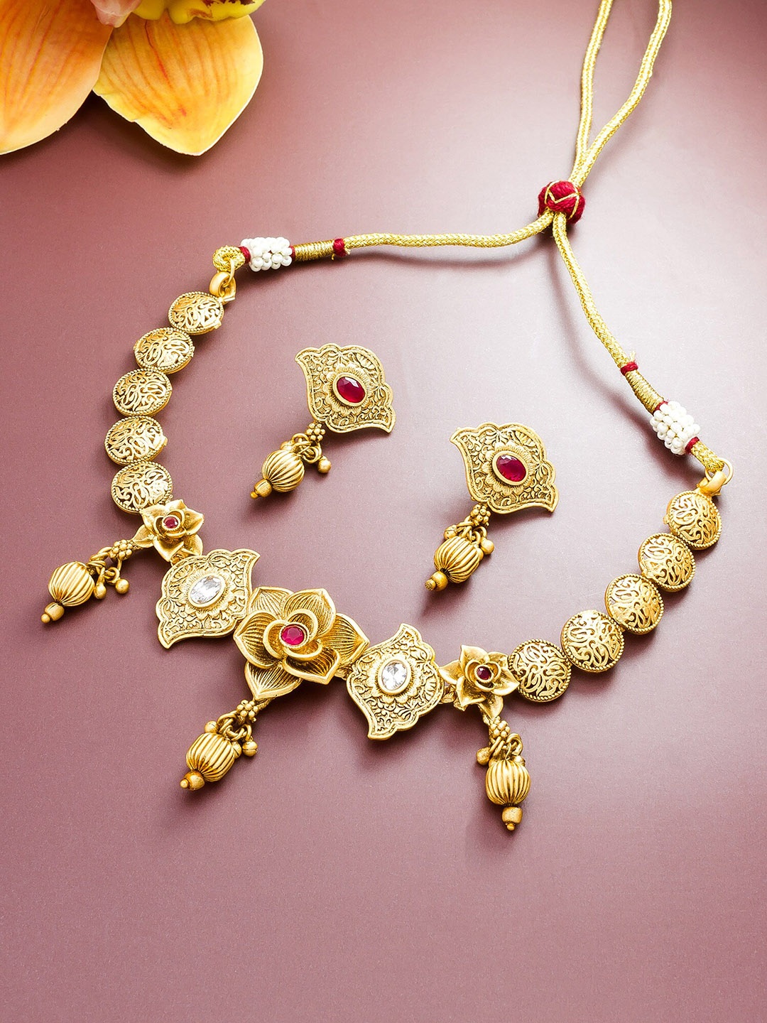 aadita Gold-Plated White & Red Stone Studded & Beaded Jewellery Set
