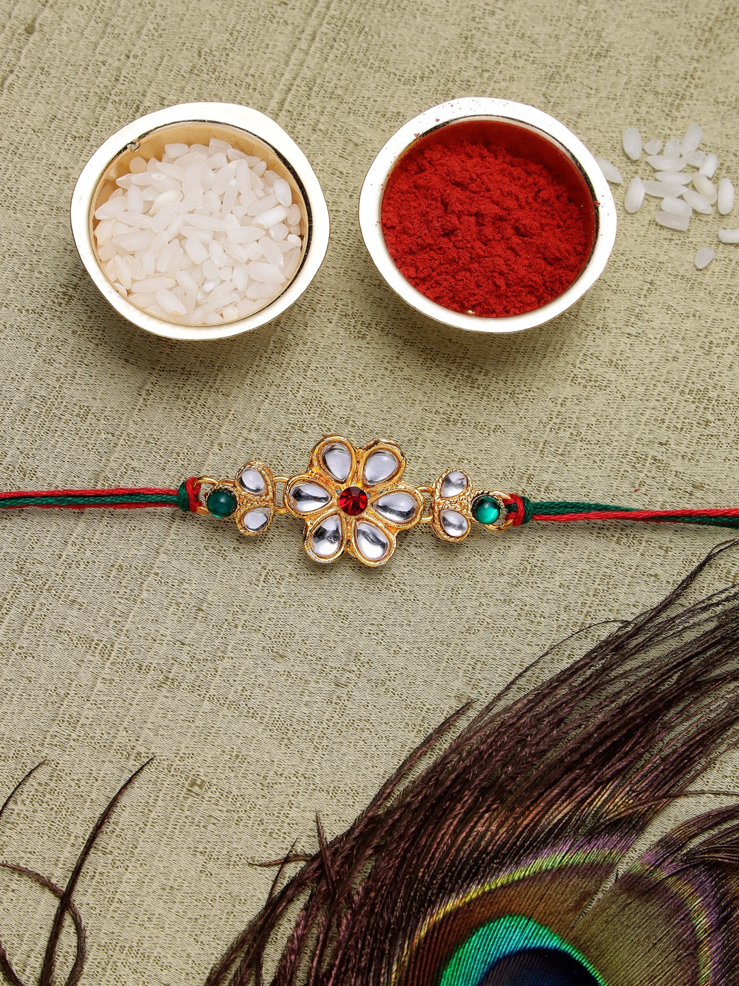 Sukkhi Rakhi Men Gold-Plated & White Kundan-Studded Rakhi With Roli Chawal & Greeting Card, Red
Sukkhi Rakhi Men Gold-Plated & White Kundan-Studded Rakhi With Roli Chawal & Greeting Card, Red