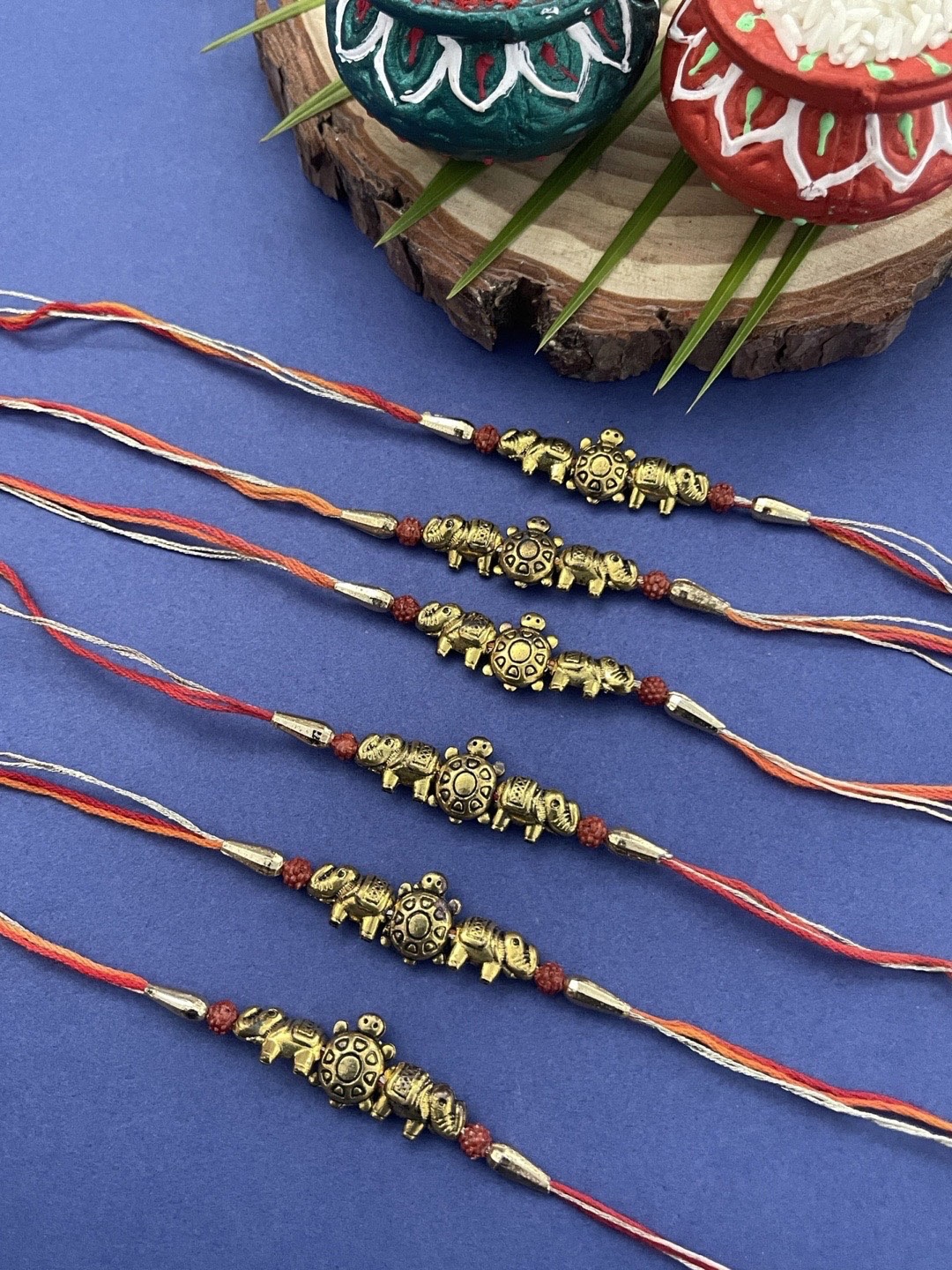 Digital Dress Room Men Set Of 6 Gold-Plated & Red Elephant & Tortoise With Thread Rakhi
Digital Dress Room Men Set Of 6 Gold-Plated & Red Elephant & Tortoise With Thread Rakhi
