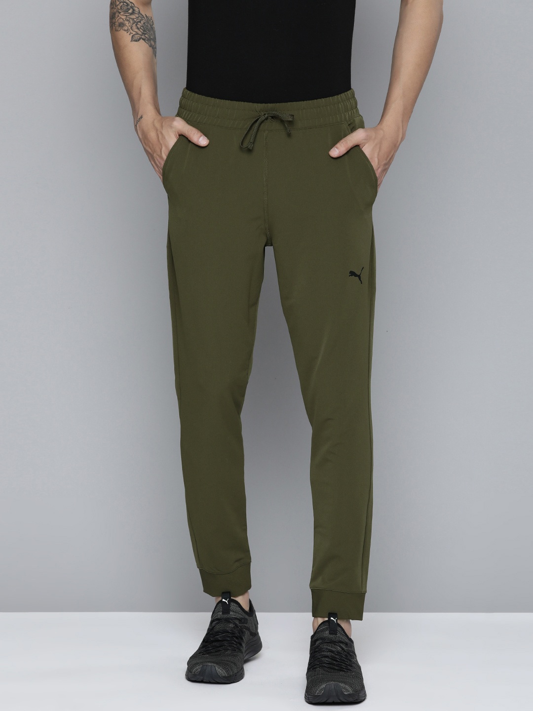 Puma Men Deep Olive Green Solid Regular Fit Mid-Rise Studio Ultramove Sustainable Joggers
Puma Men Deep Olive Green Solid Regular Fit Mid-Rise Studio Ultramove Sustainable Joggers