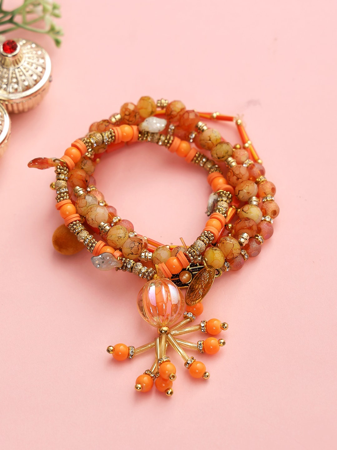 Aapno Rajasthan Women Brown & Orange Bracelet Lumba Beaded Rakhi with Roli Chawal & Greetings Card
Aapno Rajasthan Women Brown & Orange Bracelet Lumba Beaded Rakhi with Roli Chawal & Greetings Card