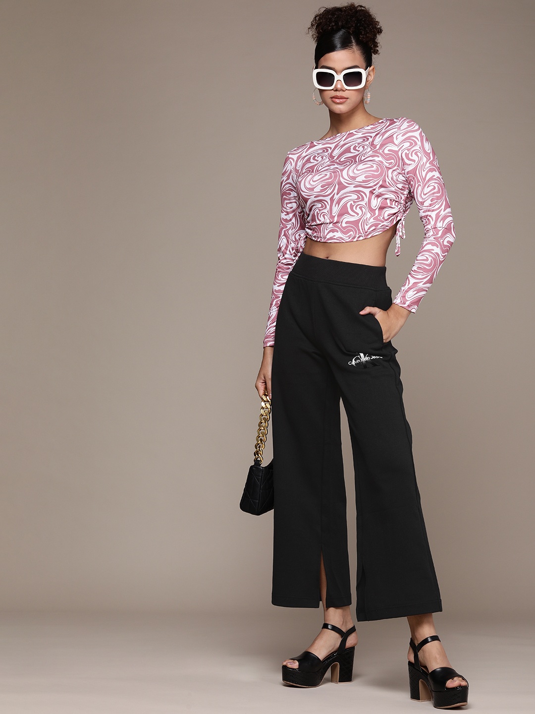 Calvin Klein Jeans Women Black Brand Logo Embroidered Wide Leg Track Pants With Side Slit
Calvin Klein Jeans Women Black Brand Logo Embroidered Wide Leg Track Pants With Side Slit