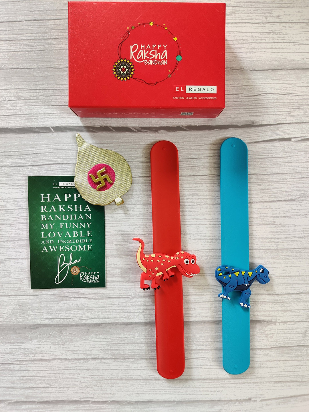 EL REGALO Kids Set of 2 Dinosaur Silicon Slap Band Rakhi With Greeting Card, Blue
EL REGALO Kids Set of 2 Dinosaur Silicon Slap Band Rakhi With Greeting Card, Blue