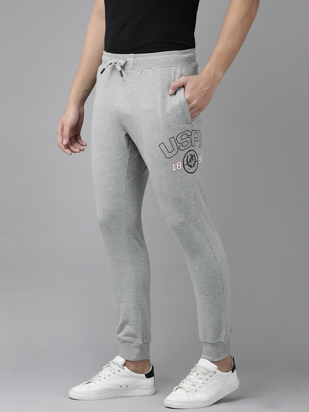U.S. Polo Assn. Denim Co. Men Grey Melange Mid-Rise Knitted Joggers With Print Detail
U.S. Polo Assn. Denim Co. Men Grey Melange Mid-Rise Knitted Joggers With Print Detail