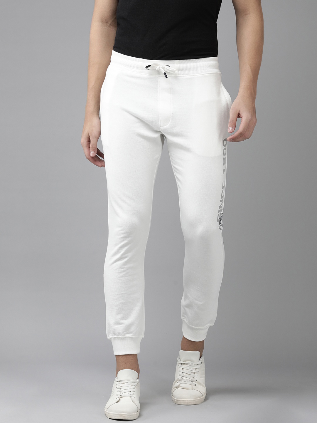 U.S. Polo Assn. Denim Co. Men Off White Mid-Rise Knitted Joggers With Brand Logo Print
U.S. Polo Assn. Denim Co. Men Off White Mid-Rise Knitted Joggers With Brand Logo Print