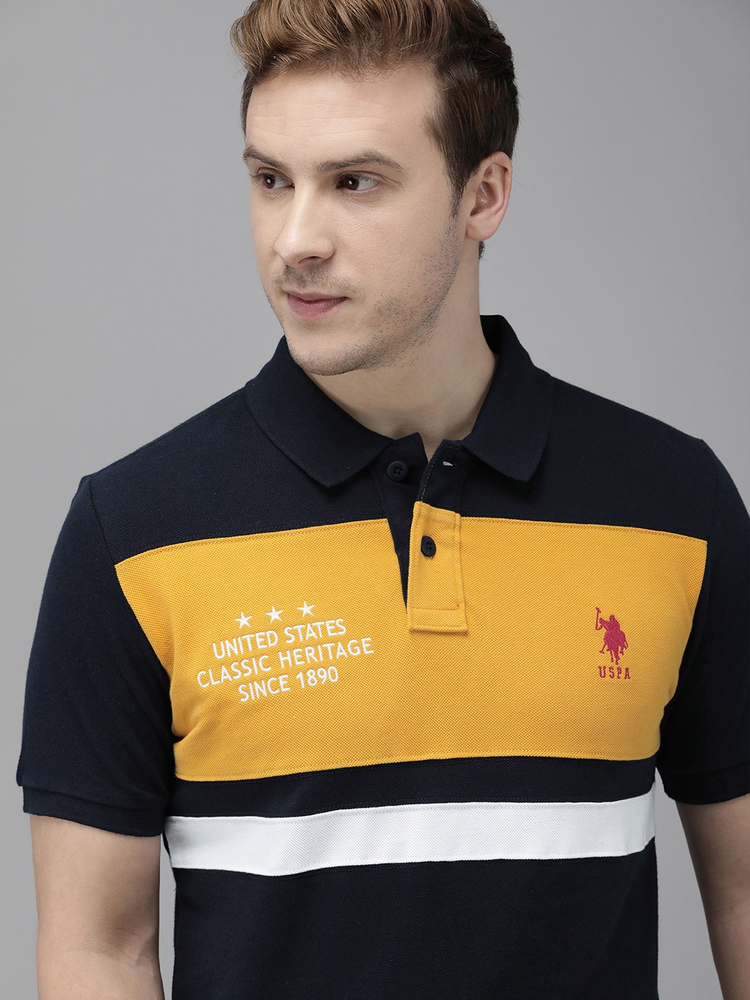 U.S. Polo Assn. Men Navy Blue & Mustard Yellow Colourblocked Pure Cotton Slim Fit T-shirt
U.S. Polo Assn. Men Navy Blue & Mustard Yellow Colourblocked Pure Cotton Slim Fit T-shirt