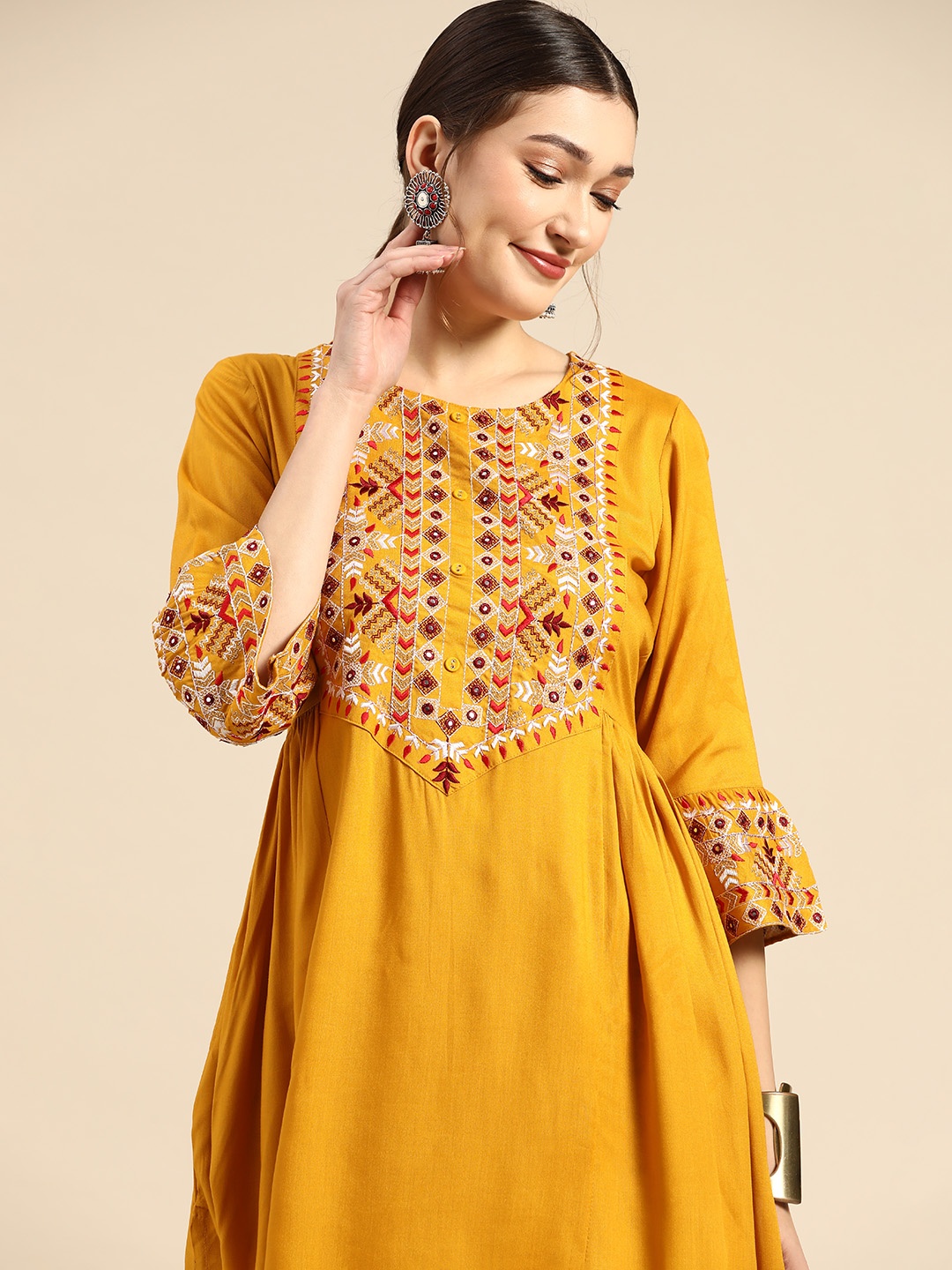 Sangria Women Mustard Yellow Embroidered Pleated Mirror Work Kurta with Palazzos
Sangria Women Mustard Yellow Embroidered Pleated Mirror Work Kurta with Palazzos