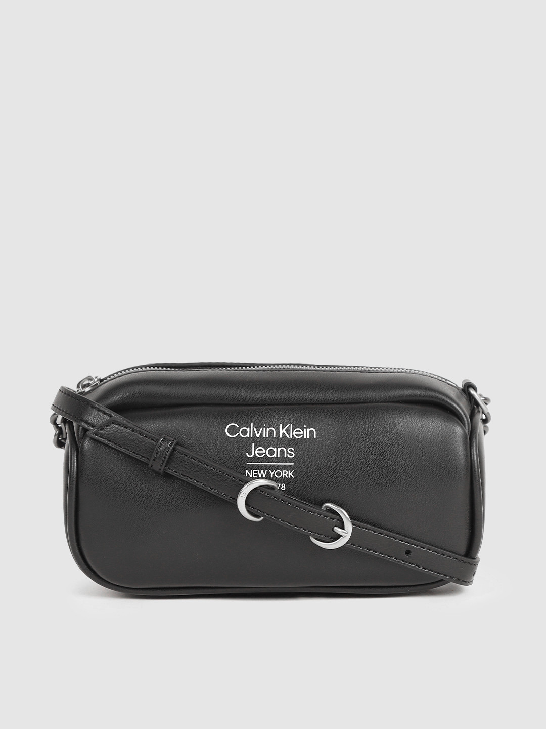Calvin Klein Jeans Black Solid Sling Bag 
Calvin Klein Jeans Black Solid Sling Bag