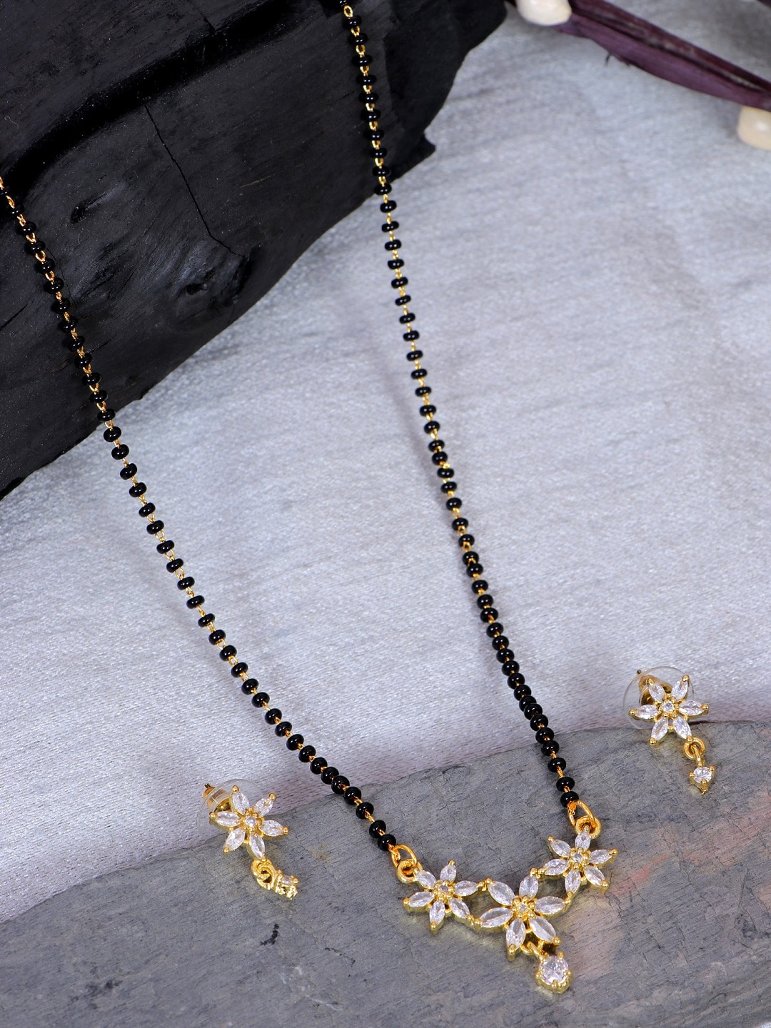 SwaDev Gold-Plated Gold-Plated Floral American Diamond & Beaded Mangalsutra With Earring
SwaDev Gold-Plated Gold-Plated Floral American Diamond & Beaded Mangalsutra With Earring