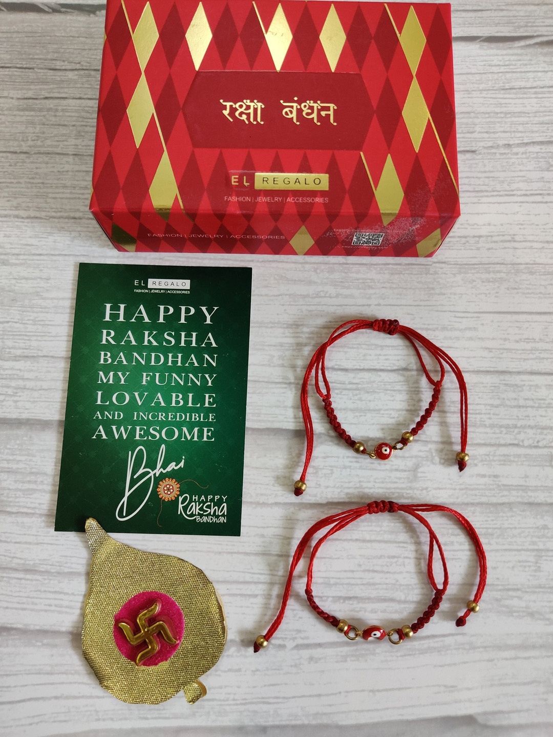 EL REGALO Set Of 2 Red Evil Eye Wrap Around Rakhi With Roli Chawal & Raksha Bandhan Greeting Card
EL REGALO Set Of 2 Red Evil Eye Wrap Around Rakhi With Roli Chawal & Raksha Bandhan Greeting Card