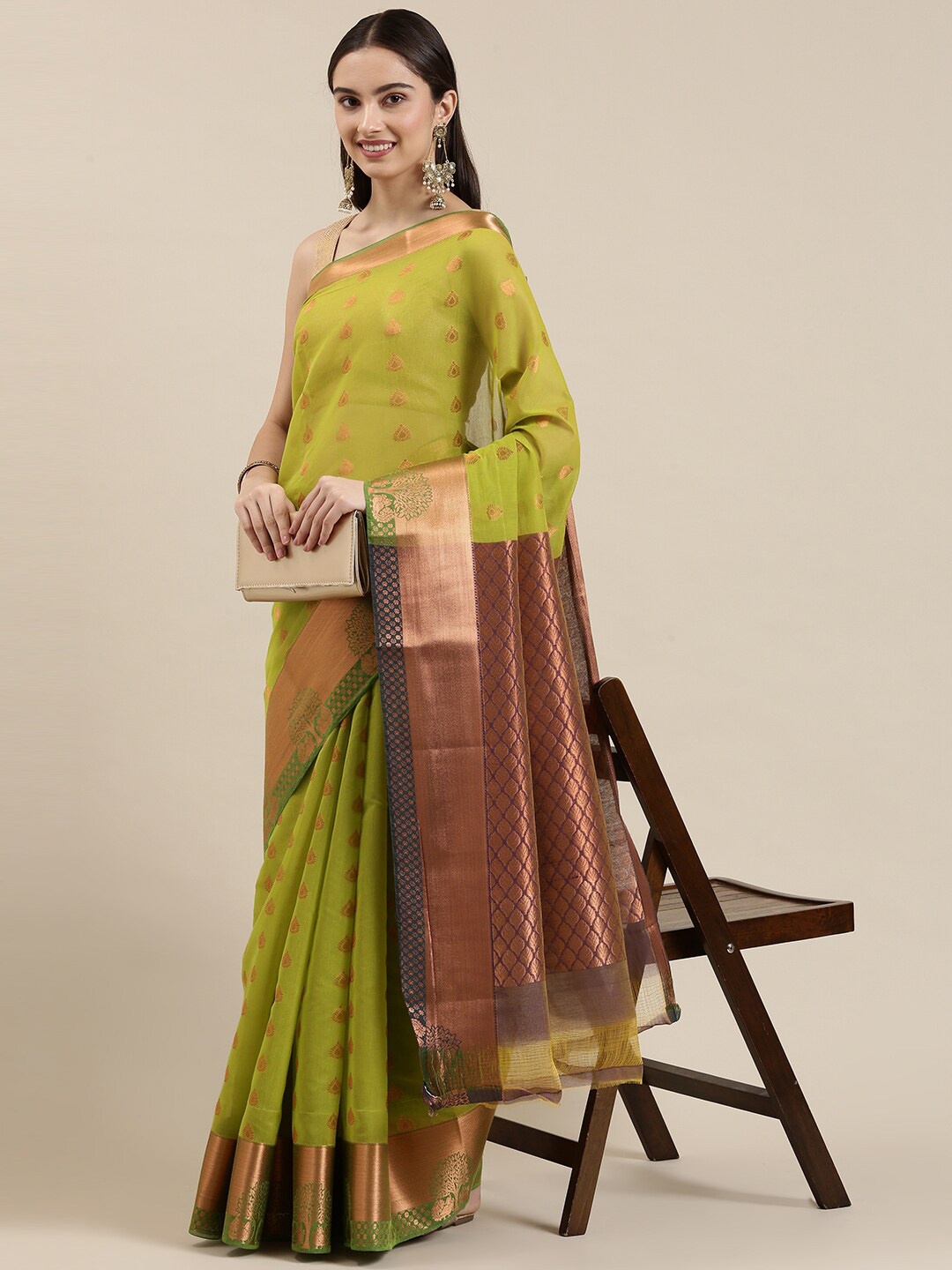 The Chennai Silks Green & Gold-Toned Woven Design Zari Silk Cotton Fusion Maheshwari Saree
The Chennai Silks Green & Gold-Toned Woven Design Zari Silk Cotton Fusion Maheshwari Saree